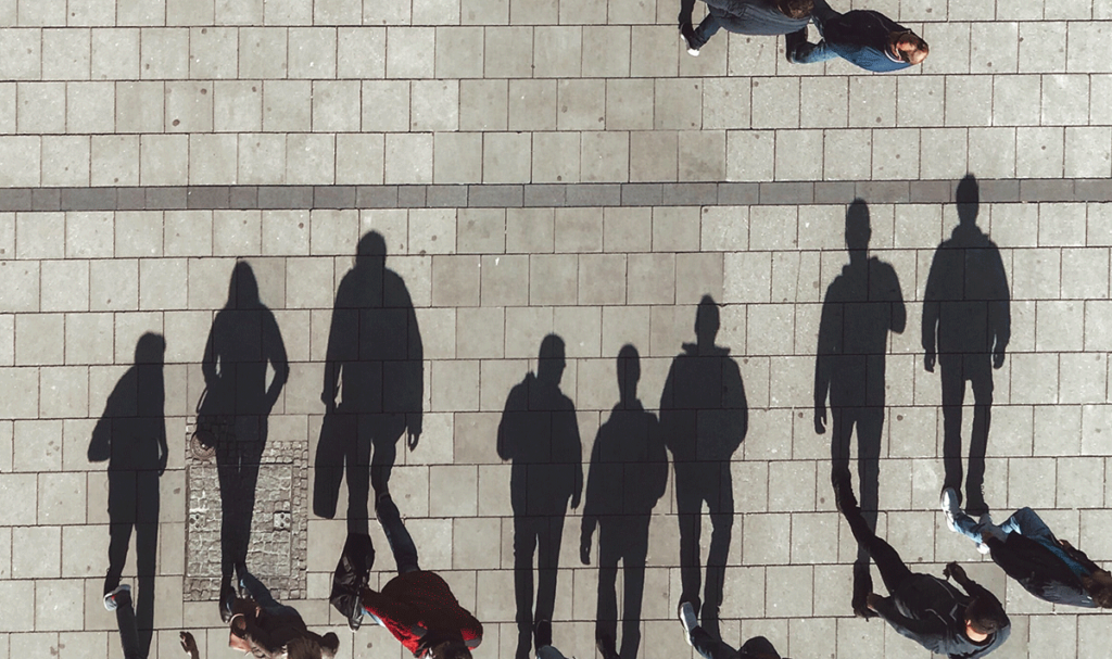 People and their shadows in front of them