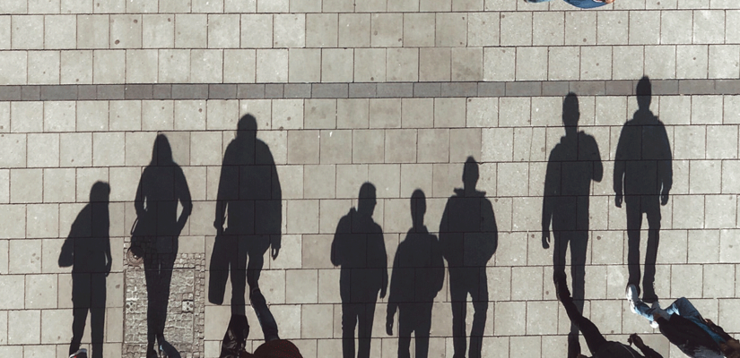 People and their shadows in front of them